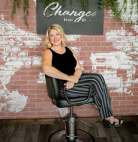 Abbie sitting in a chair and posing for a photo