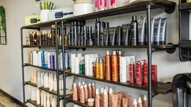 Shampoos, conditioners and styling products on display that are available for purchase at Changes Hair Studio